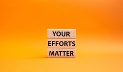 Your Efforts Matter symbol. Wooden blocks with words Your Efforts Matter. Beautiful orange background. Business and Your Efforts Matter concept. Copy space.