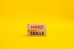 Hard skills symbol. Wooden blocks with words Hard skills. Beautiful yellow background. Business and Hard skills concept. Copy space.