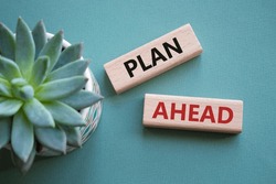 Plan ahead symbol. Wooden blocks with words Plan ahead. Beautiful grey green background with succulent plant. Business and Plan ahead concept. Copy space. Concept word