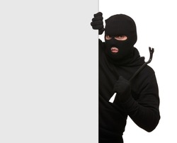 Thief in mask with crowbar on white background, free space.