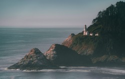 Oregon Coastline with Lighthouse on rock cliff