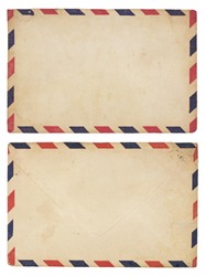 The front and back of an aging airmail envelope with red and blue striped border. Isolated on white with clipping path.