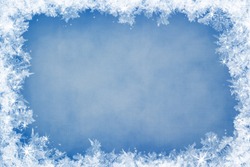 Winter frame of gleaming ice, in the center of the composition aged textured background