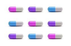 A set of colorful, white, pink, blue and violet medicine tablet capsule antibiotic pills on isolated white background for medical healthcare concept.