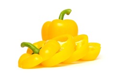 Whole and sliced yellow bell pepper or paprika isolated on white background.