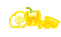Half and slice of yellow bell pepper or paprika isolated on white background.