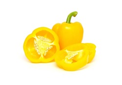 Whole and half of yellow bell pepper or paprika isolated on white background.