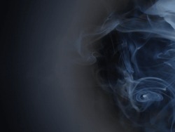 Graceful swirls of white smoke in black background. Close-up of vapor. Soft focus and texture from vintage Helios 44m-4 lens. Abstract graphic design asset. Horizontal copy space.