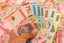 indonesian money, new series rupiah of banknote. rupiah money with blur background. Rupiah money from indonesia. Rupiah money for buying and selling transactions.