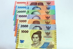 Isolated Money of Indonesia, Rupiah. Collection of the indonesian rupiah new 2022 edition banknotes. Close up new issuance of Rupiah banknotes isolated on white background.