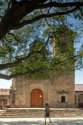 chapel Old building, village church, colonial architecture walls, aged wooden door, with steel rivets,