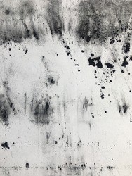 Scattered toner from a printer on a white paper sheet, abstract background, texture, pattern
