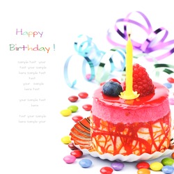 Colorful birthday cake isolated over white