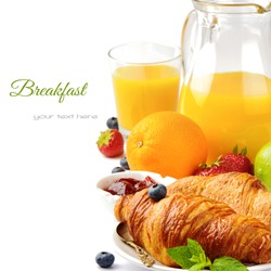 Breakfast with orange juice and fresh croissants
