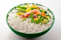 Green bowl with vegetables basmati rice and shrimp isolated on white background