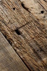 Recycle wood, grunge wood texture from lumber of an old abandoned railway converted to table top close up. Soft focus image.