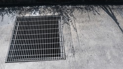 Steel grating .Steel grating cover on street sewer drain manhole.