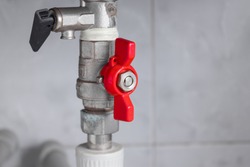 Red valve that provides water supply.