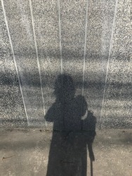 Shadow of Human on a House Wall