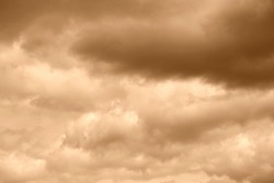 Cloud on a sepia color sky background. High resolution photo.