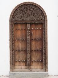 Traditional Zanzibar door with spikes. Indian door style.	