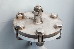 Pipe section with flange and welded adapter with stainless steel chain and screwed bolts. Ship flange for receiving or dispensing water or fuel.