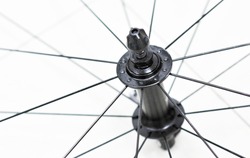 Closeup of front bicycle wheel, hub and spokes of road bike