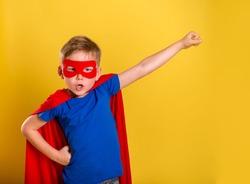 Little child boy play superhero. Happy smiling kid in glasses with star. Success, motivation concept. 