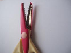Pink Zigzag scissor with white background