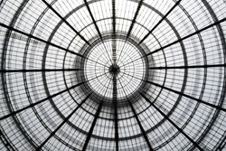 Double exposure photo of transparent circular glass ceiling / roof at two different zooms. Realistic but not real architectural image with doubled number of circles compared to the real object.