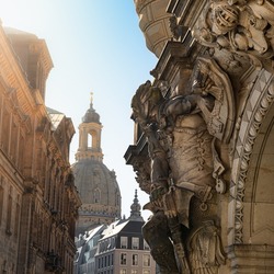 Sculpture of a statue of a warrior at the George Gate or Georgentor, in the background Church of our Lady or Frauenkirche. Dresden, Saxony, Germany