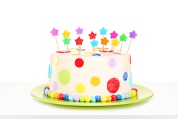 Studio shot of a colorful delicious cake with stars decorations isolated on white background