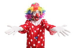 Excited clown spreading arms isolated on white background