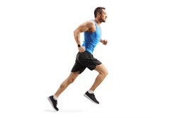 Full length shot of a young man in sportswear running isolated on white background