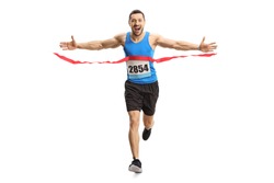 Full length portrait of a happy young man finishing a marathon race on the finish line isolated on white background