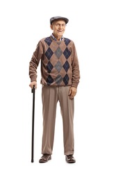 Full length portrait of a senior man standing with a walking cane and smiling at the camera isolated on white background