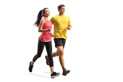 Full length shot of a young man and woman in sportswear jogging isolated on white background