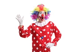 Funny cheerful clown waving isolated on white background