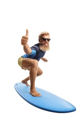 Bearded young man surfing and showing thumbs up isolated on white background