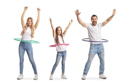 Family of a mother, father and daughter spinning hula hoops isolated on white background