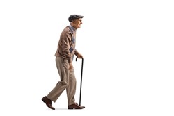 Full length profile shot of an elderly man with a walking cane in his hand isolated on white background