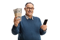 Mature man holding money and a smartphone isolated on white background