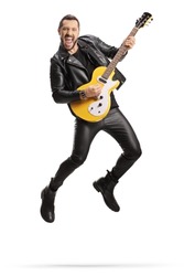 Man in leather clothes playing an electric guitar and jumping isolated on white background 