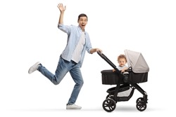 Full length profile shot of a happy father running with a baby in a stroller isolated on white background