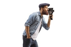 Profile shot of a man recording with 8mm vintage camera isolated on white background