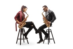 Modern young sax players sitting on chairs and performing isolated on white background