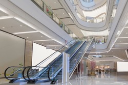 escalator and modern shopping mall interior