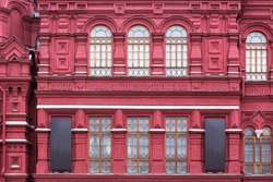 Vintage architecture red brick classical facade in.pseudo-Russian style.  Front view close up