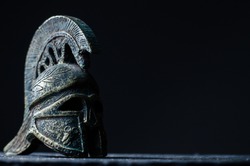 Roman helmet on a dark background
