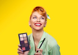Creative beauty makeup artist. Closeup red head beautiful young woman pretty smiling pinup girl green button shirt holding eyeshadow pallette brush looking at you camera, retro vintage 50's hairstyle